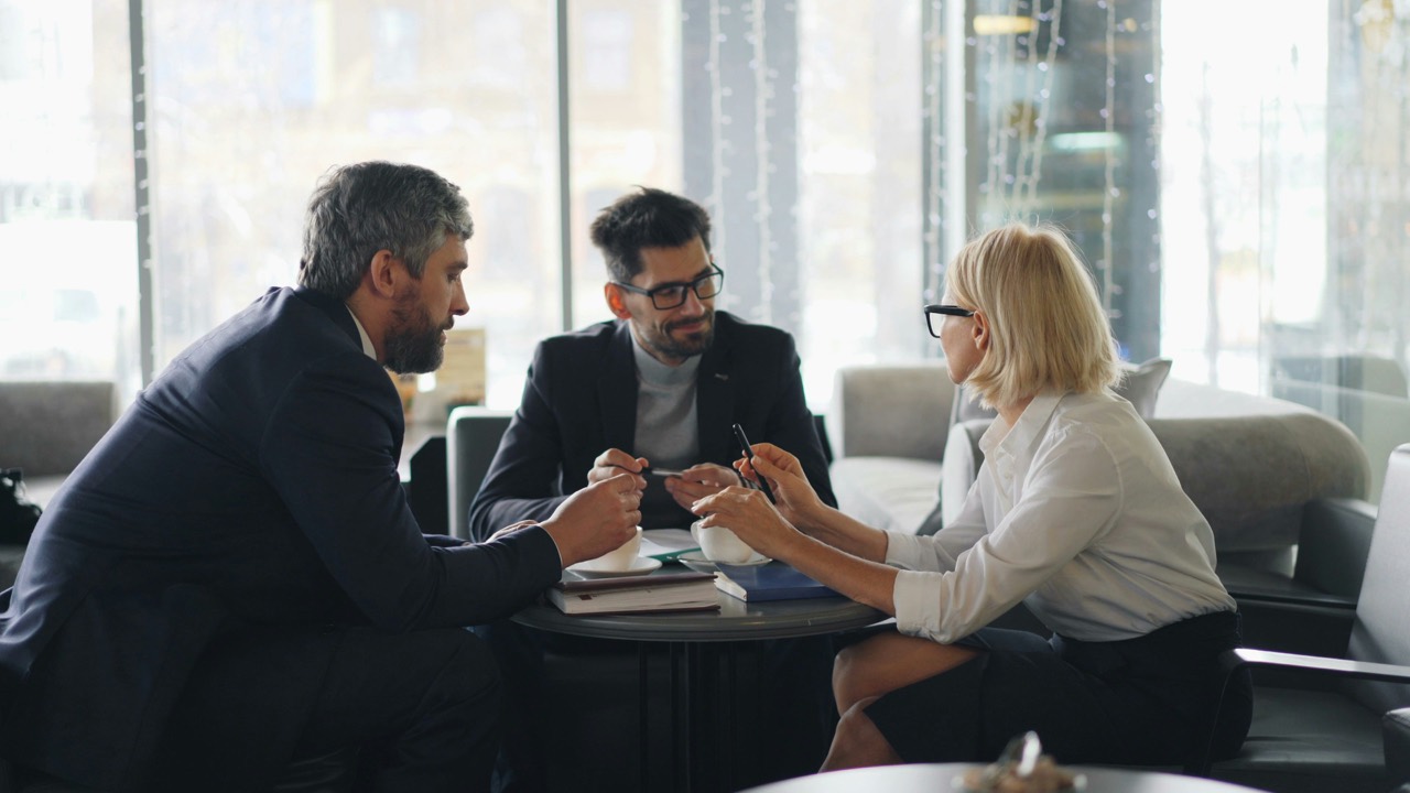 People meeting around a table in a calm, modern office