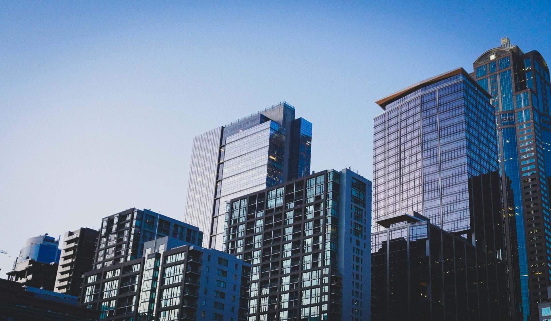High-rise towers against a clear evening sky