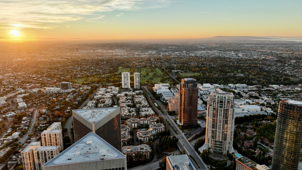 Aerial view of a city skyline at sunset